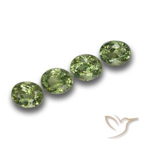 Pedras preciosas de Granada demantóide verde quente natural de 1.39 ct, oval, VS