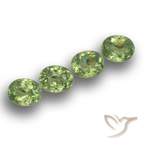 Pedras preciosas de Granada demantóide verde quente natural de 1.52 ct, oval, VS
