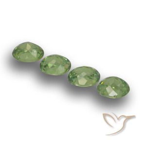 Pedras preciosas de Granada demantóide verde quente natural de 1.48 ct, oval, VS