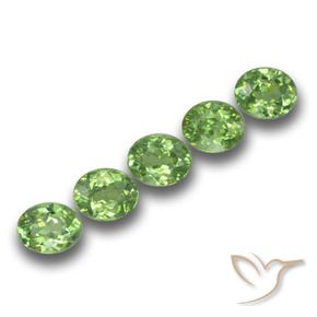 Pedras preciosas de Granada demantóide verde quente natural de 1.74 ct, oval, VS