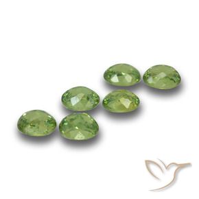 Pedras preciosas de Granada demantóide verde quente natural de 1.79 ct, oval, VS