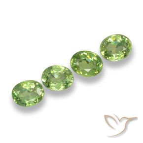 Pedras preciosas de Granada demantóide verde quente natural de 1.08 ct, oval, VS
