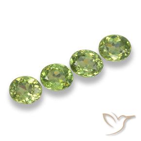Pedras preciosas de Granada demantóide verde quente natural de 1.90 ct, oval, VS