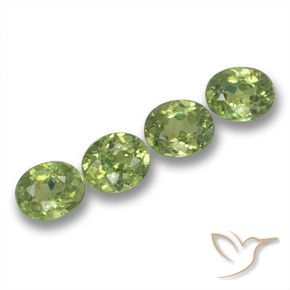 Pedras preciosas de Granada demantóide verde quente natural de 1.73 ct, oval, VS