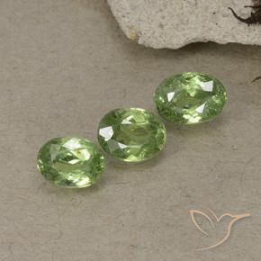 Pedras preciosas de Granada demantóide verde quente natural de 1.55 ct, oval, VS-SI