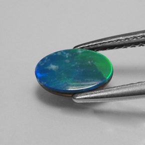 Dupleto de opala multicolorido natural 0,73ct, corte oval, opaco