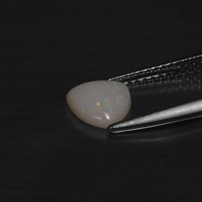 Opala multicolorido natural 0,60ct, trillion, translúcido