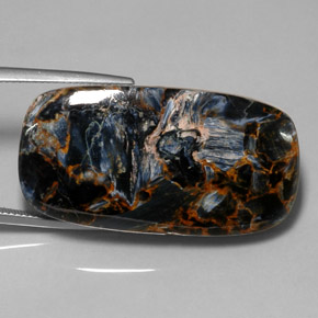 Pietersita multicolorido natural 52,84ct, almofada cortada, opaco