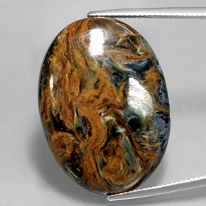 Pietersita multicolorido natural 31,58ct, corte oval, opaco