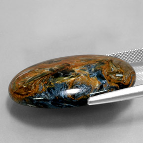Pietersita multicolorido natural 31,58ct, corte oval, opaco