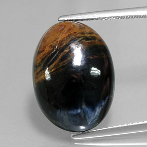 Pietersita multicolorido natural 12,64ct, corte oval, opaco