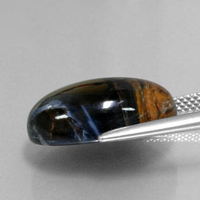 Pietersita multicolorido natural 12,64ct, corte oval, opaco