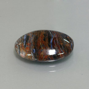 Pietersita multicolorido natural 6,80ct, corte oval, opaco