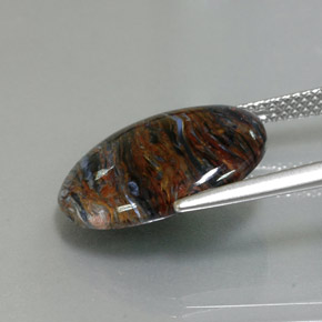 Pietersita multicolorido natural 6,80ct, corte oval, opaco