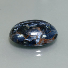 Pietersita multicolorido natural 9,37ct, corte oval, opaco