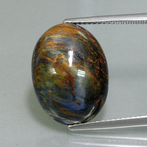 Pietersita multicolorido natural 9,76ct, corte oval, opaco