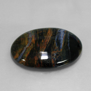 Pietersita multicolorido natural 27,17ct, corte oval, opaco