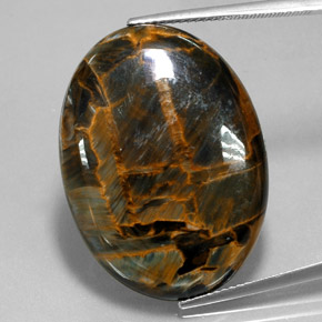Pietersita azul natural 30,34ct, corte oval, opaco
