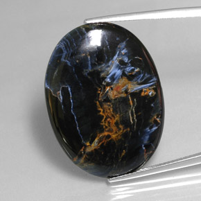 Pietersita multicolorido natural 24,54ct, corte oval, opaco