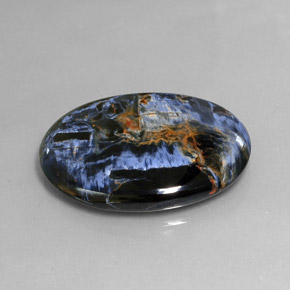 Pietersita multicolorido natural 24,54ct, corte oval, opaco