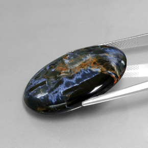 Pietersita multicolorido natural 24,54ct, corte oval, opaco