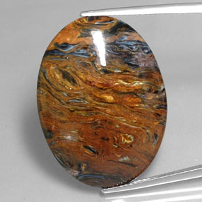 Pietersita multicolorido natural 25,47ct, corte oval, opaco