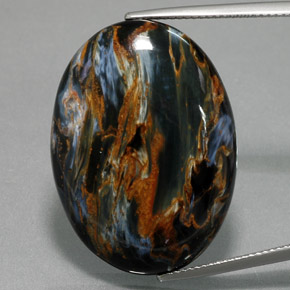 Pietersita azul natural 32,61ct, corte oval, opaco