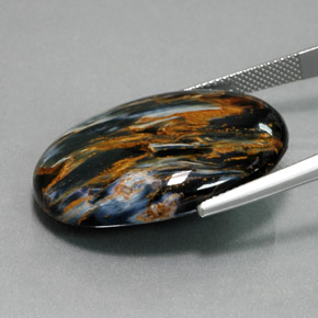 Pietersita azul natural 32,61ct, corte oval, opaco