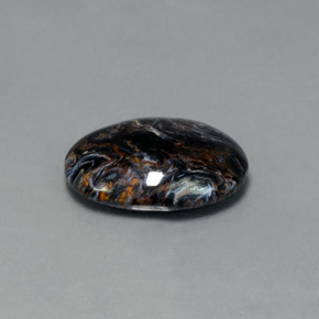 Pietersita multicolorido natural 7,09ct, corte oval, opaco