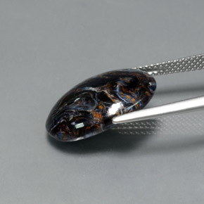Pietersita multicolorido natural 7,09ct, corte oval, opaco