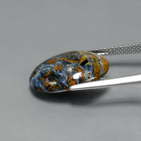 Pietersita multicolorido natural 7,33ct, corte oval, opaco