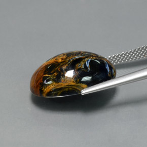 Pietersita multicolorido natural 11,81ct, corte oval, opaco