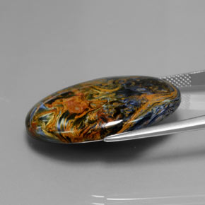 Pietersita multicolorido natural 24,42ct, corte oval, opaco