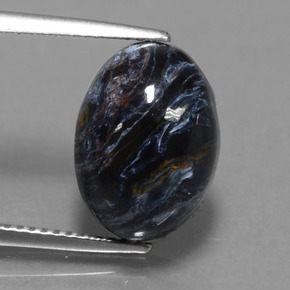 Pietersita multicolorido natural 6,21ct, corte oval, opaco