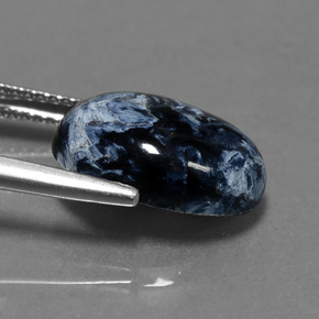 Pietersita multicolorido natural 4,85ct, corte oval, opaco