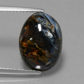 Pietersita multicolorido natural 6,33ct, corte oval, opaco