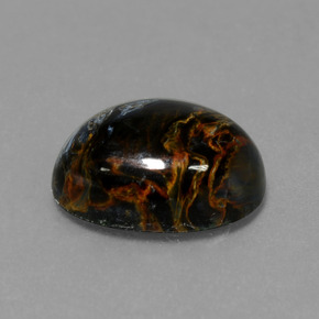 Pietersita multicolorido natural 6,33ct, corte oval, opaco
