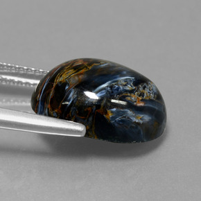 Pietersita multicolorido natural 6,33ct, corte oval, opaco