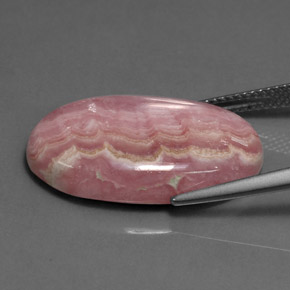 Rodocrosita rosa natural 18,74ct, corte oval, opaco