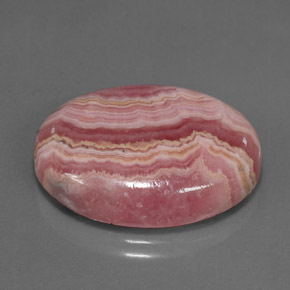 Rodocrosita multicolorido natural 24,57ct, corte oval, opaco