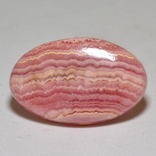 Rodocrosita multicolorido natural 30,65ct, corte oval, opaco