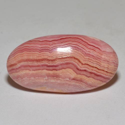Rodocrosita multicolorido natural 23,40ct, corte oval, opaco
