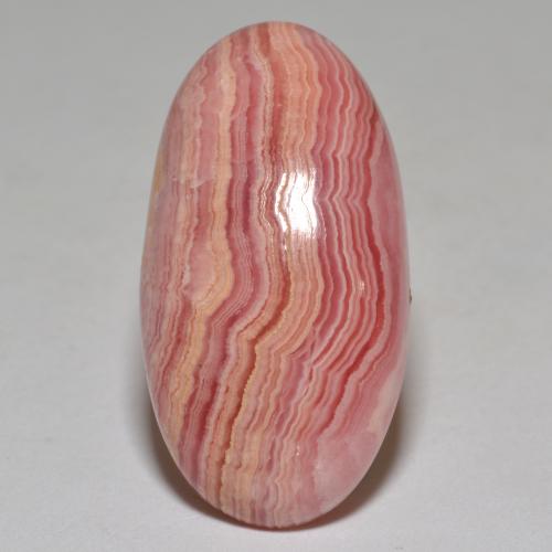 Rodocrosita multicolorido natural 23,40ct, corte oval, opaco