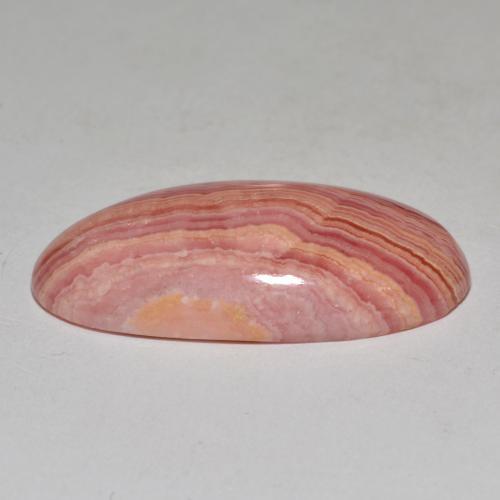 Rodocrosita multicolorido natural 23,40ct, corte oval, opaco