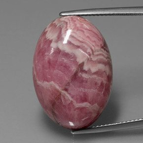 Rodocrosita multicolorido natural 32,83ct, corte oval, opaco