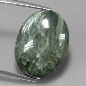 Serafinita verde natural 11,47ct, corte oval, opaco