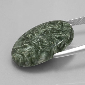 Serafinita verde natural 19,04ct, corte oval, opaco