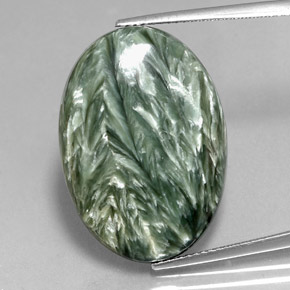 Serafinita verde natural 23,76ct, corte oval, opaco