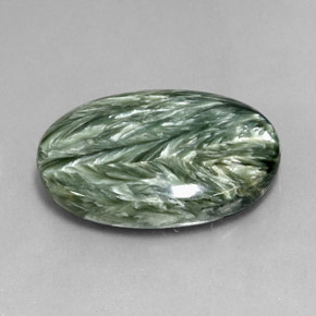 Serafinita verde natural 23,76ct, corte oval, opaco