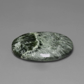 Serafinita verde natural 25,77ct, corte oval, opaco